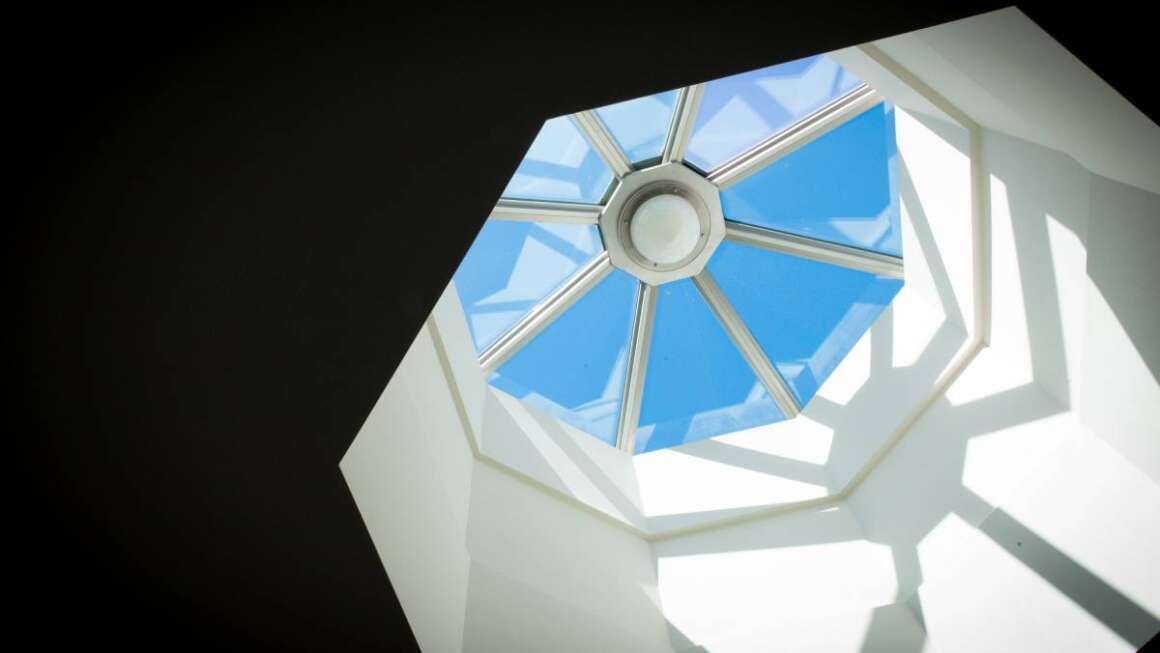 Octagon shaped skylight window and blue sky